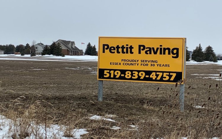 Petting Paving sign that reads "Proudly Serving Essex County for 30 Years. 519-839-4757"
