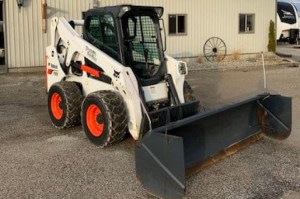 Bobcat with snow plow attached